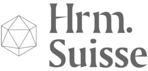 A geometric 3D wireframe shape with the text "Hrm. Suisse" in gray modern font next to it.